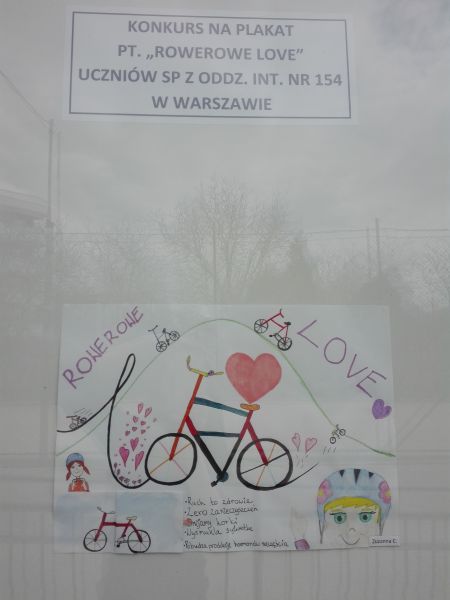 plakat wykonany przez ucznia: napis :Rowerowe love”, narysowany rower i serce